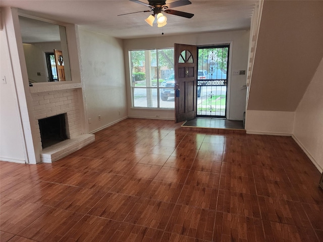 2614 Santa Barbara Dr, Grand Prairie, TX 75052 - unfurnished living room with ceiling fan, a brick fireplace, baseboards, and wood finished floors