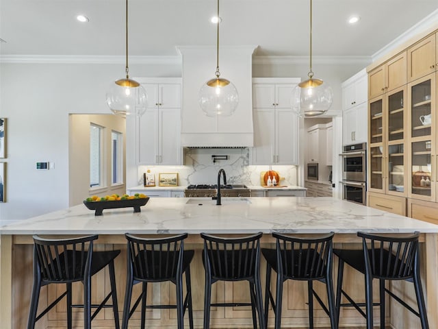 2015 Honey Ln, Celina, TX 75009 - kitchen with double oven, crown molding, tasteful backsplash, recessed lighting, and a large island with sink
