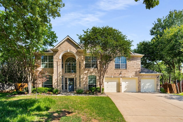 4 Raintree Ct, Mansfield, TX 76063 - traditional home with concrete driveway, brick siding, and an attached garage