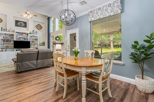 4 Raintree Ct, Mansfield, TX 76063 - dining area with wood finished floors, a chandelier, a ceiling fan, baseboards, and ornamental molding