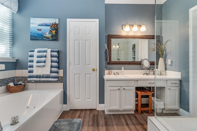 4 Raintree Ct, Mansfield, TX 76063 - full bath featuring wood finished floors, a whirlpool tub, vanity, and a shower