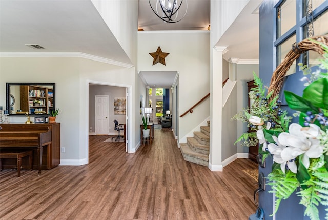 4 Raintree Ct, Mansfield, TX 76063 - entryway with baseboards, wood finished floors, crown molding, and stairway