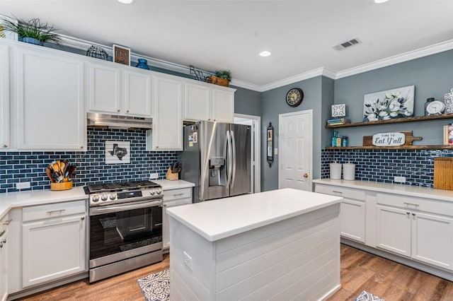 4 Raintree Ct, Mansfield, TX 76063 - kitchen with stainless steel appliances, crown molding, open shelves, under cabinet range hood, and white cabinetry