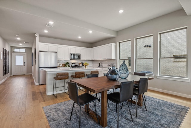 10645 Nokose St, Fort Worth, TX 76179 - dining space featuring light wood-style floors, baseboards, and recessed lighting