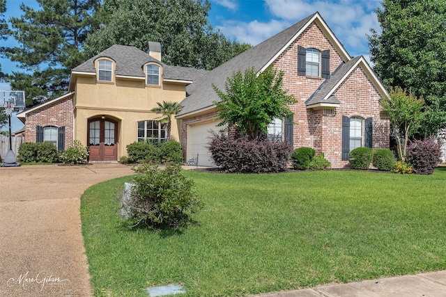view of front of home featuring an attached garage, brick siding, a front lawn, and a chimney