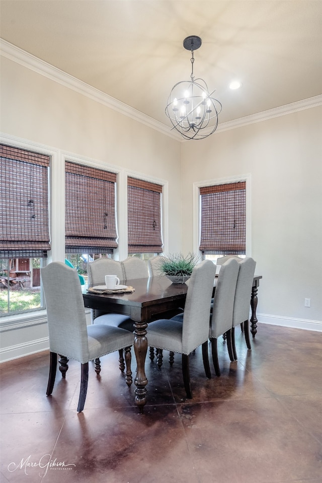 dining area with a chandelier, ornamental molding, concrete flooring, and baseboards