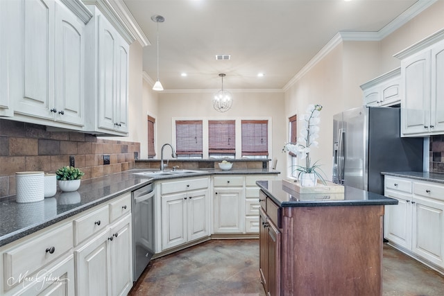 kitchen with a sink, stainless steel appliances, tasteful backsplash, ornamental molding, and recessed lighting