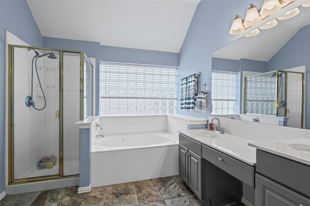 1701 Travis Ct, Allen, TX 75002 - bathroom with lofted ceiling, a bath, double vanity, and a stall shower