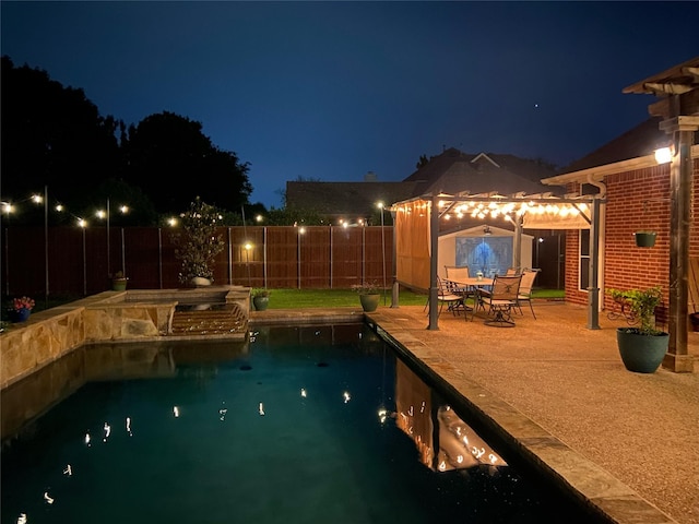 1701 Travis Ct, Allen, TX 75002 - pool at twilight featuring a pool with connected hot tub and a patio