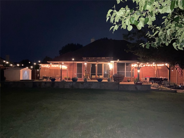 1701 Travis Ct, Allen, TX 75002 - back of house at twilight featuring a pergola and a patio area