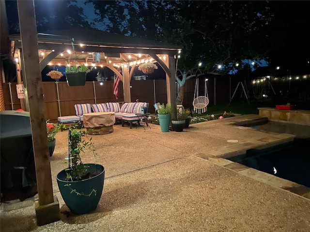1701 Travis Ct, Allen, TX 75002 - patio at twilight with a gazebo, a patio, and a fenced backyard