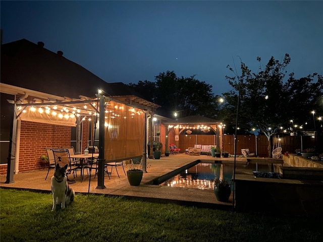 1701 Travis Ct, Allen, TX 75002 - deck at night featuring a gazebo and a patio