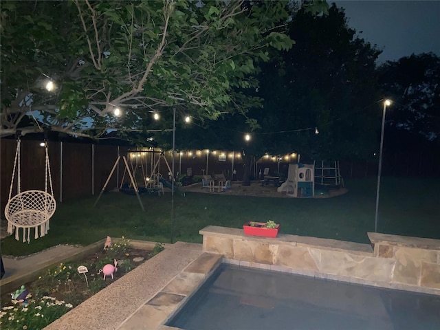 1701 Travis Ct, Allen, TX 75002 - yard at twilight featuring a playground and an outdoor pool