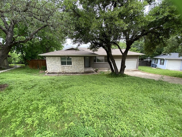 4233 Ridgecrest Cir, Lake Worth, TX 76135 - single story home with an attached garage, driveway, and stone siding