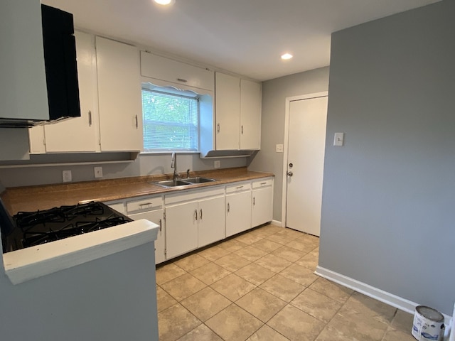 4233 Ridgecrest Cir, Lake Worth, TX 76135 - kitchen featuring a sink, white cabinetry, light countertops, and recessed lighting