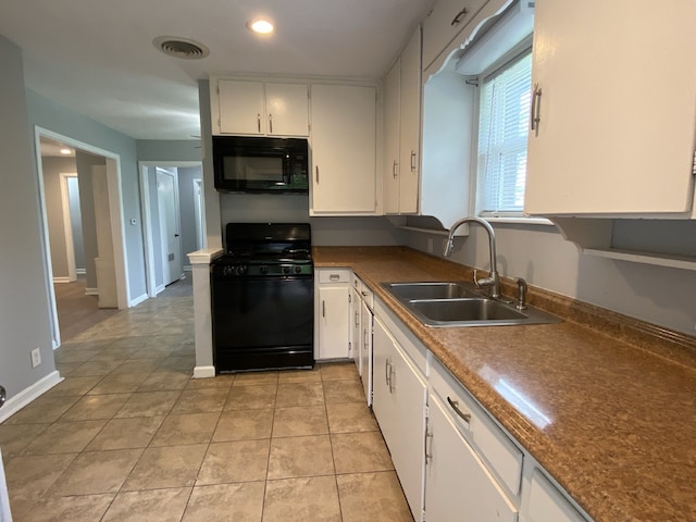 4233 Ridgecrest Cir, Lake Worth, TX 76135 - kitchen featuring black appliances, a sink, white cabinetry, light tile patterned floors, and recessed lighting