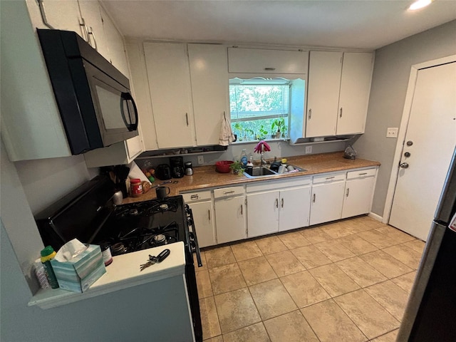 4233 Ridgecrest Cir, Lake Worth, TX 76135 - kitchen featuring black appliances, white cabinetry, light countertops, light tile patterned flooring, and a sink