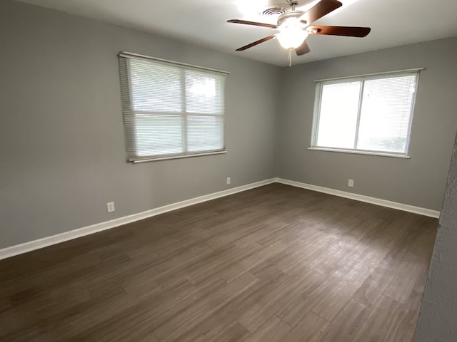 4233 Ridgecrest Cir, Lake Worth, TX 76135 - spare room with healthy amount of natural light, a ceiling fan, dark wood finished floors, and baseboards
