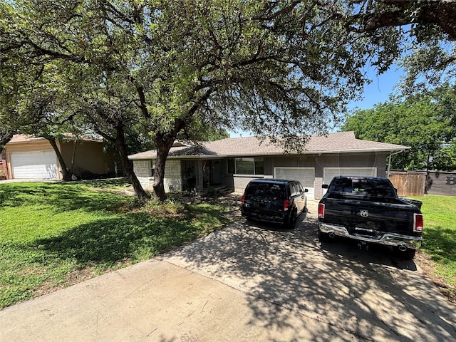 4233 Ridgecrest Cir, Lake Worth, TX 76135 - single story home with a garage, a front lawn, driveway, and brick siding