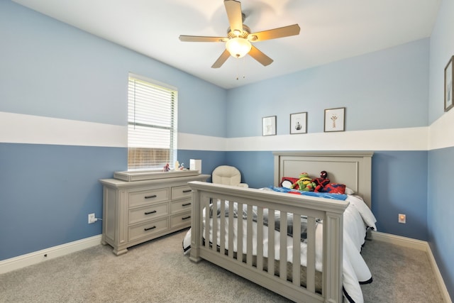 1250 Amistad Dr, Prosper, TX 75078 - bedroom with light carpet, baseboards, ceiling fan, and a nursery area