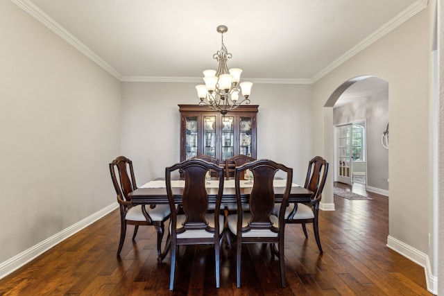1250 Amistad Dr, Prosper, TX 75078 - dining space featuring a chandelier, arched walkways, crown molding, baseboards, and dark wood-type flooring