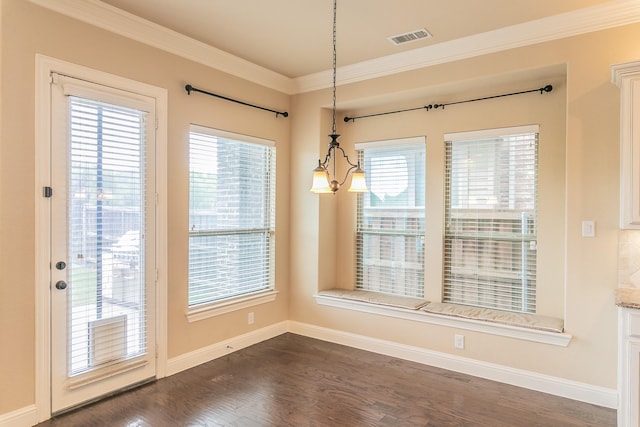 unfurnished dining area with ornamental molding, baseboards, plenty of natural light, and dark wood-type flooring