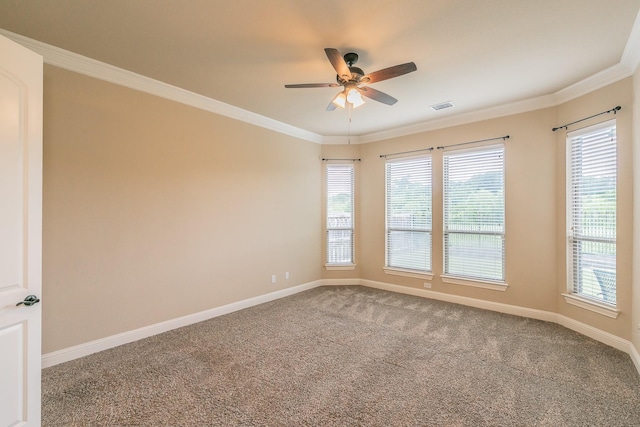 empty room with carpet, a ceiling fan, baseboards, and ornamental molding