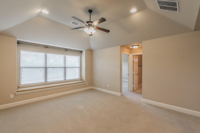 spare room with lofted ceiling, light colored carpet, a ceiling fan, baseboards, and recessed lighting