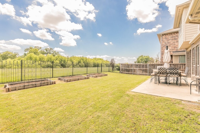 view of yard with a garden and a patio