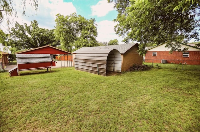 405 W Neely Ave, Comanche, TX 76442 - view of yard with central AC unit and an outdoor structure