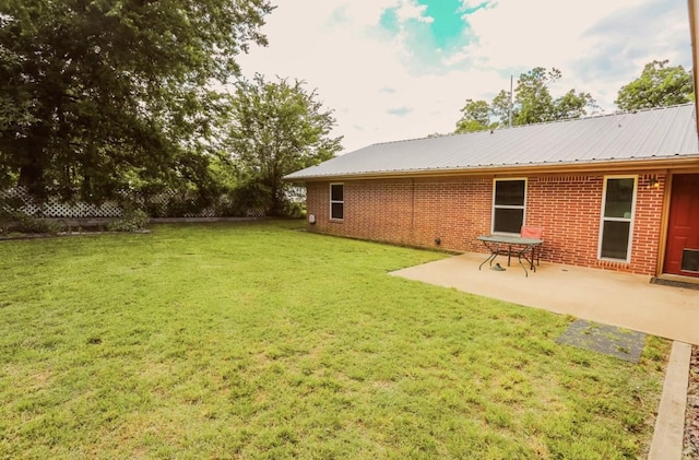 405 W Neely Ave, Comanche, TX 76442 - view of green lawn with a patio