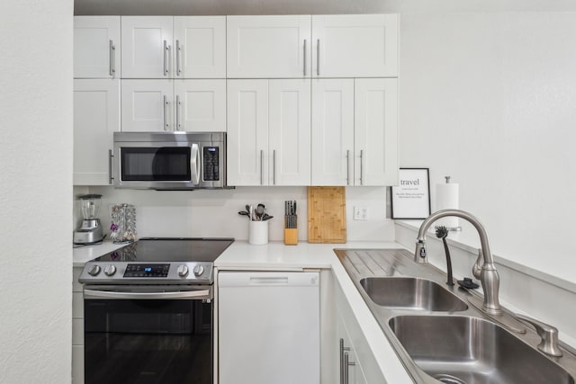 4800 W Lovers Ln Unit 113, Dallas, TX 75209 - kitchen featuring stainless steel appliances, a sink, white cabinetry, and light countertops