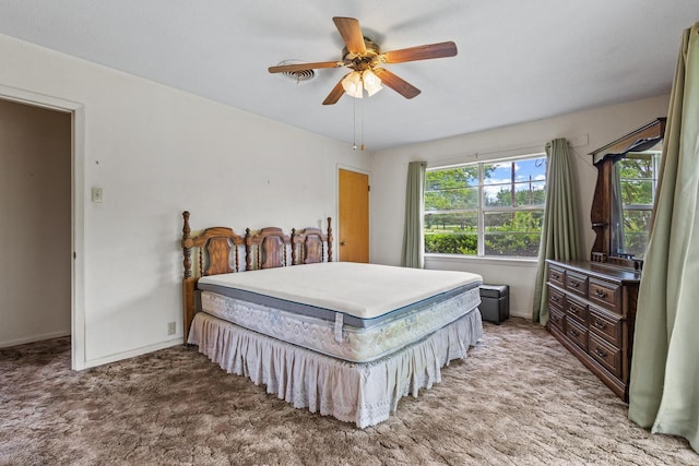 531 Eisenhower Rd, Denison, TX 75020 - bedroom with light carpet, baseboards, and ceiling fan