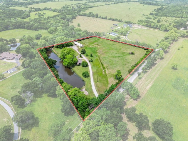 531 Eisenhower Rd, Denison, TX 75020 - aerial view of sparsely populated area with a nearby body of water and property parcel outlined