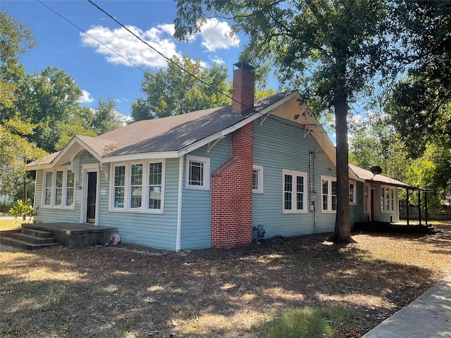 118 S 31st St, Corsicana, TX 75110 - view of property exterior with a chimney