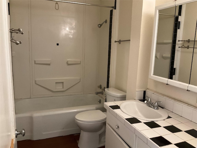 118 S 31st St, Corsicana, TX 75110 - bathroom featuring toilet, washtub / shower combination, and vanity