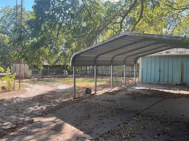 118 S 31st St, Corsicana, TX 75110 - view of car parking with fence, a detached carport, and driveway