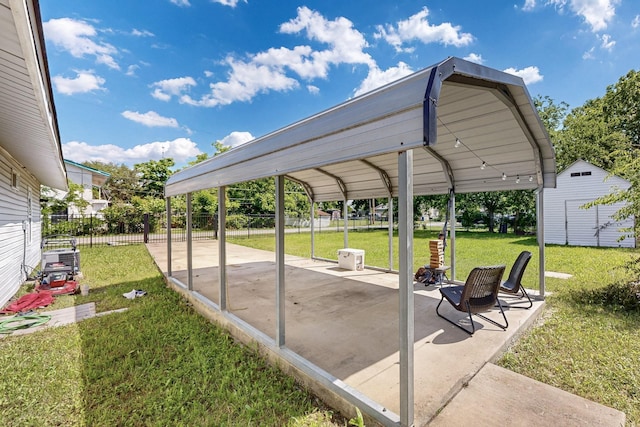 1508 E Dellis St, Kaufman, TX 75142 - view of patio / terrace with an outdoor structure and a shed