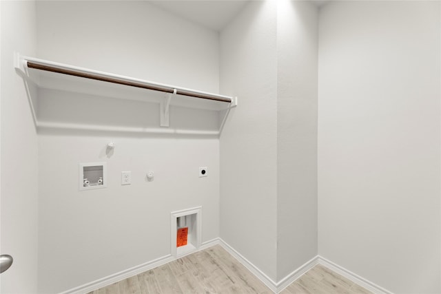 1705 Teton Riv, Blue Ridge, TX 75424 - washroom with hookup for a gas dryer, light wood finished floors, hookup for an electric dryer, washer hookup, and baseboards