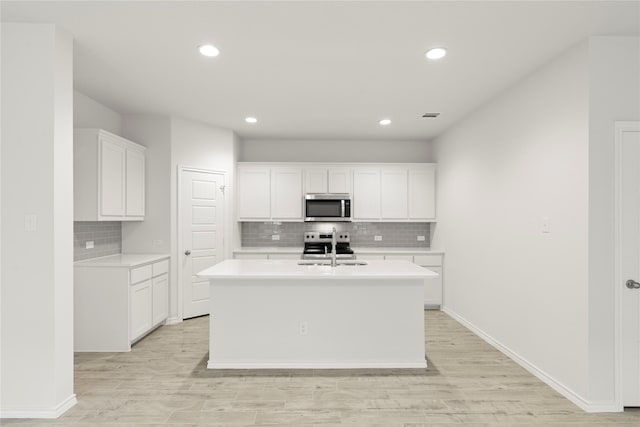 1705 Teton Riv, Blue Ridge, TX 75424 - kitchen featuring appliances with stainless steel finishes, tasteful backsplash, light countertops, a sink, and recessed lighting