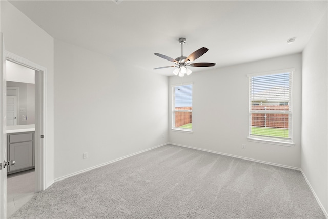 1705 Teton Riv, Blue Ridge, TX 75424 - unfurnished bedroom featuring light carpet, multiple windows, and baseboards