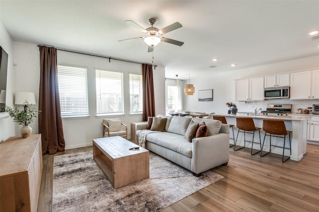 509 Poplar St, Princeton, TX 75407 - living area featuring a ceiling fan, light wood-style flooring, and recessed lighting