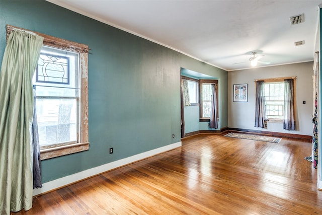 5020 Junius St, Dallas, TX 75214 - empty room featuring ornamental molding, wood-type flooring, and a ceiling fan