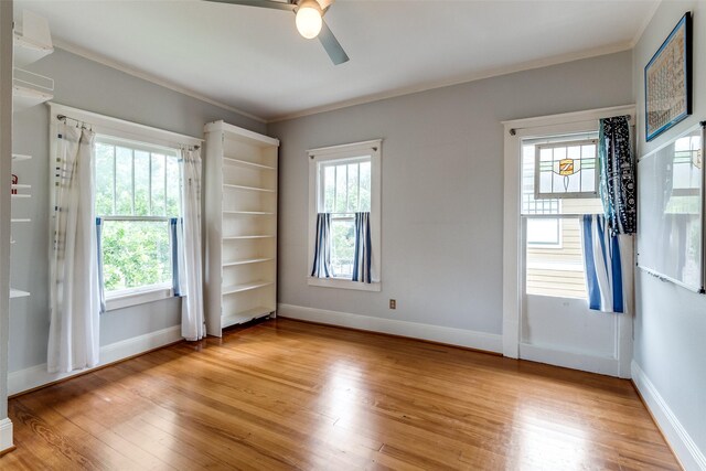 5020 Junius St, Dallas, TX 75214 - unfurnished room with a ceiling fan, ornamental molding, healthy amount of natural light, and light wood finished floors