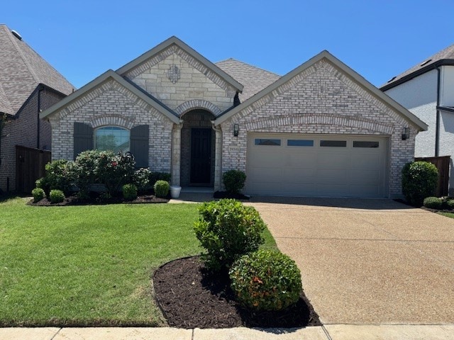 2434 Solomons Pl, Wylie, TX 75098 - french country style house featuring a garage, brick siding, concrete driveway, and a front yard