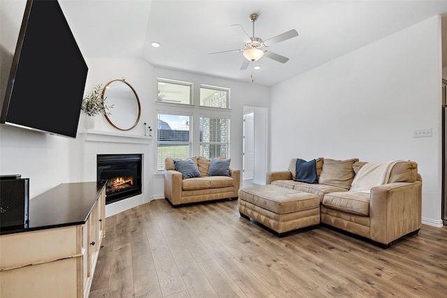 2434 Solomons Pl, Wylie, TX 75098 - living room with a ceiling fan, a glass covered fireplace, light wood-style floors, recessed lighting, and baseboards