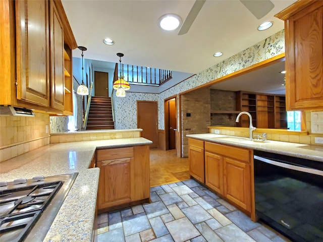 912 Chadwick Dr, Richardson, TX 75080 - kitchen featuring black dishwasher, a peninsula, wallpapered walls, a sink, and stainless steel gas cooktop