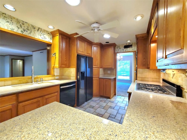 912 Chadwick Dr, Richardson, TX 75080 - kitchen with black appliances, a sink, stone tile floors, ceiling fan, and backsplash