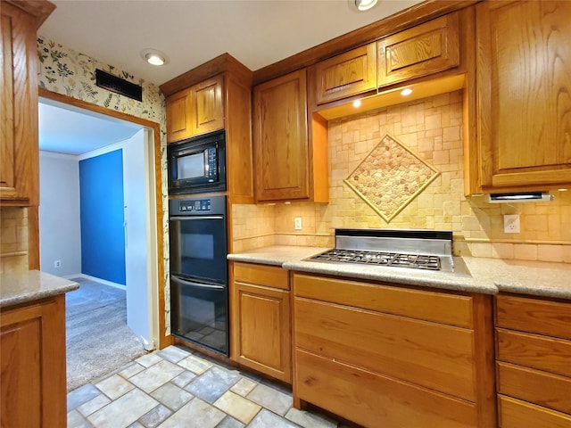 912 Chadwick Dr, Richardson, TX 75080 - kitchen with black appliances, brown cabinets, backsplash, and recessed lighting