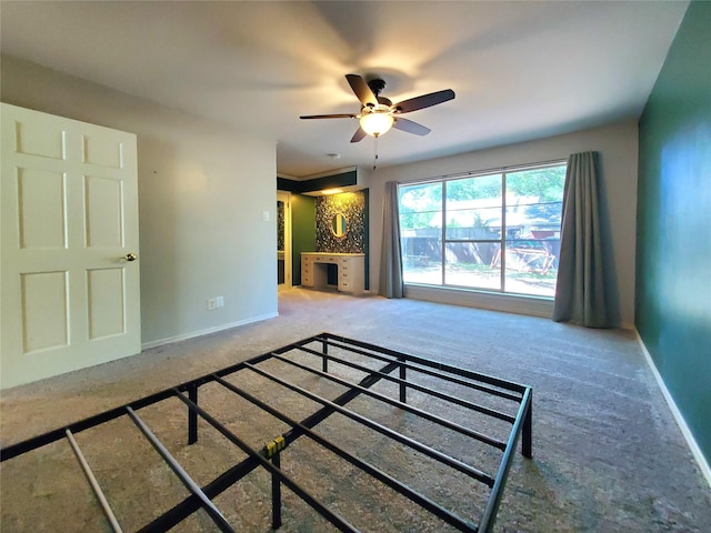 912 Chadwick Dr, Richardson, TX 75080 - unfurnished bedroom featuring carpet flooring, baseboards, and ceiling fan